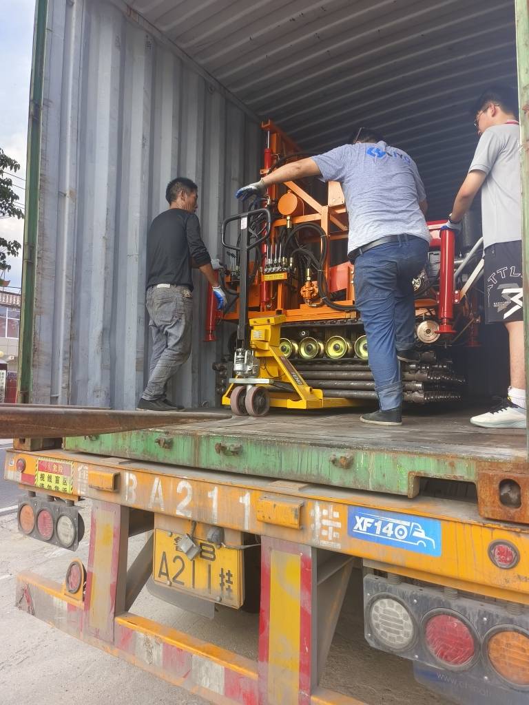 Water well drilling rig loading into export container